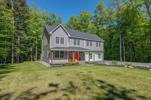 26 John Adams Ct, Naples, ME 04055 - view of front of home with a garage, covered porch, concrete driveway, a front lawn, and roof with shingles