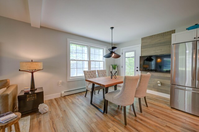 26 John Adams Ct, Naples, ME 04055 - dining space with baseboard heating, light wood-type flooring, baseboards, and beam ceiling
