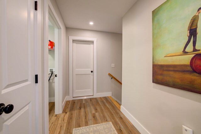 26 John Adams Ct, Naples, ME 04055 - corridor with an upstairs landing, light wood-type flooring, baseboards, and recessed lighting