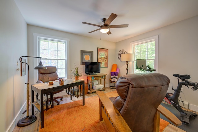26 John Adams Ct, Naples, ME 04055 - living room featuring a desk, light wood-type flooring, ceiling fan, and baseboards