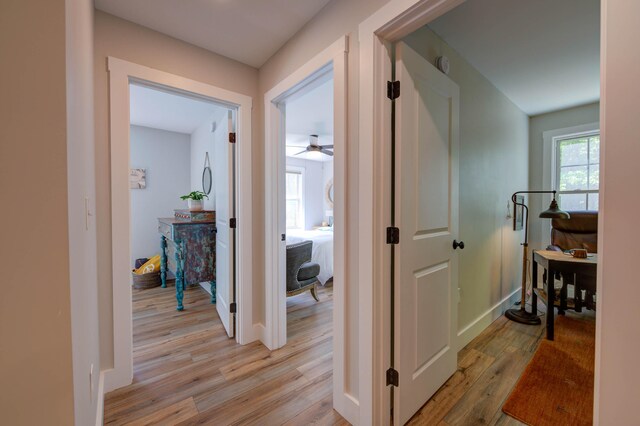 26 John Adams Ct, Naples, ME 04055 - hall with light wood-style floors and baseboards