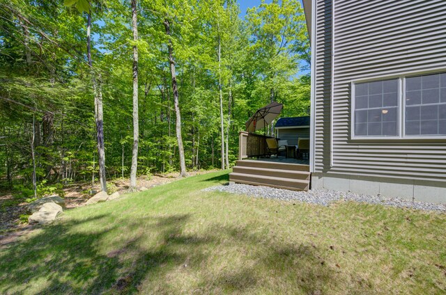 26 John Adams Ct, Naples, ME 04055 - view of green lawn featuring a deck