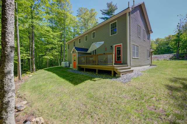 26 John Adams Ct, Naples, ME 04055 - rear view of house featuring a deck and a lawn