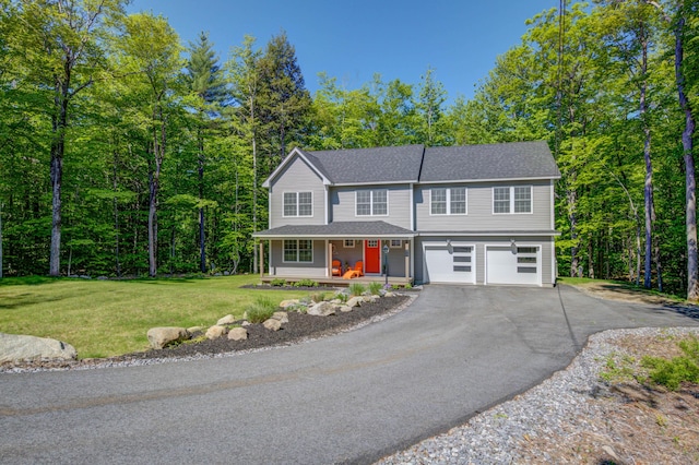 26 John Adams Ct, Naples, ME 04055 - view of front of property with a porch, a garage, asphalt driveway, a front lawn, and a shingled roof