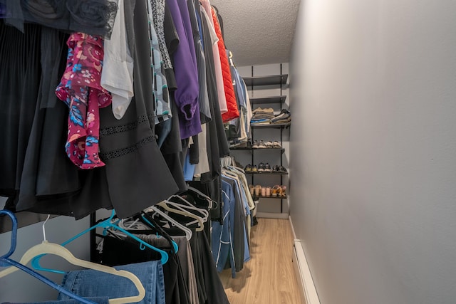 46 Silver Rdg, Veazie, ME 04401 - spacious closet with wood finished floors and a baseboard heating unit