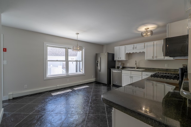 46 Silver Rdg, Veazie, ME 04401 - kitchen with stainless steel appliances, a sink, dark countertops, white cabinetry, and baseboards
