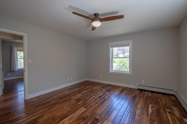 46 Silver Rdg, Veazie, ME 04401 - unfurnished room with ceiling fan, dark wood-type flooring, baseboards, and a baseboard heating unit