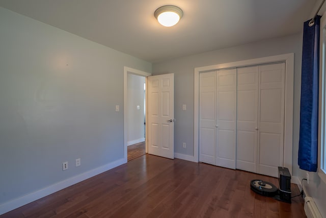 46 Silver Rdg, Veazie, ME 04401 - unfurnished bedroom with baseboards, wood finished floors, a closet, and a baseboard heating unit
