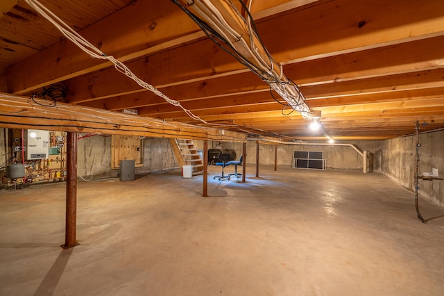 46 Silver Rdg, Veazie, ME 04401 - unfinished basement featuring stairway and water heater