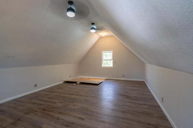 46 Silver Rdg, Veazie, ME 04401 - bonus room featuring vaulted ceiling, baseboards, dark wood-type flooring, a textured ceiling, and ceiling fan