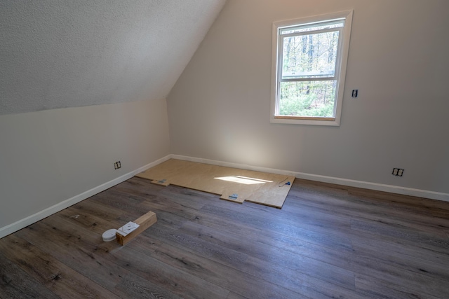 46 Silver Rdg, Veazie, ME 04401 - bonus room with lofted ceiling, baseboards, wood finished floors, and a textured ceiling