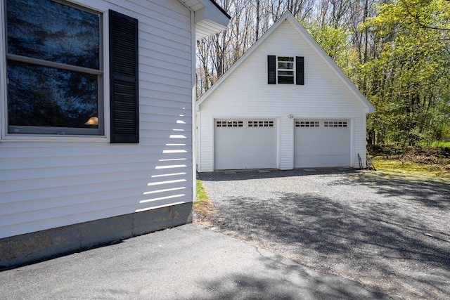 46 Silver Rdg, Veazie, ME 04401 - view of side of home with a detached garage and an outbuilding