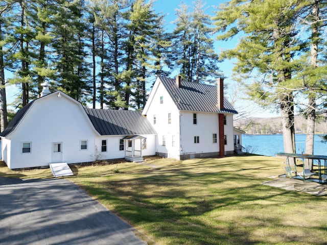 112 Buker Rd, Litchfield, ME 04350 - view of side of property with a chimney, metal roof, a lawn, a water view, and a standing seam roof
