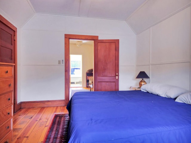 112 Buker Rd, Litchfield, ME 04350 - bedroom with vaulted ceiling and wood-type flooring
