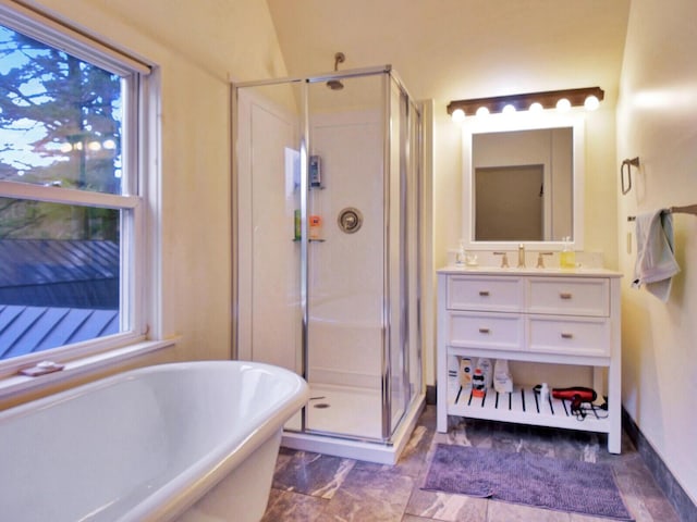 112 Buker Rd, Litchfield, ME 04350 - full bathroom featuring a shower stall, vanity, a freestanding bath, and baseboards