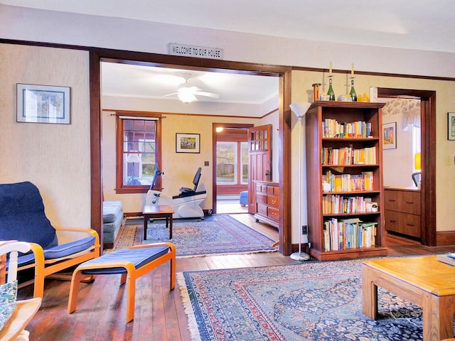 112 Buker Rd, Litchfield, ME 04350 - living area featuring a ceiling fan, hardwood / wood-style flooring, crown molding, and baseboards
