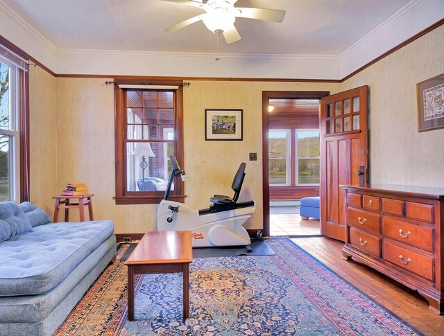 112 Buker Rd, Litchfield, ME 04350 - living room with wood finished floors, ceiling fan, and crown molding