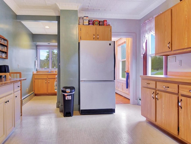 112 Buker Rd, Litchfield, ME 04350 - kitchen with freestanding refrigerator, baseboard heating, light countertops, crown molding, and recessed lighting