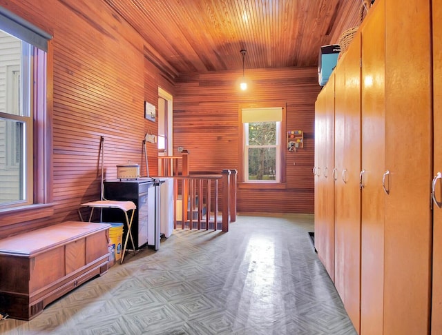 112 Buker Rd, Litchfield, ME 04350 - corridor with wooden ceiling, wood walls, and an upstairs landing