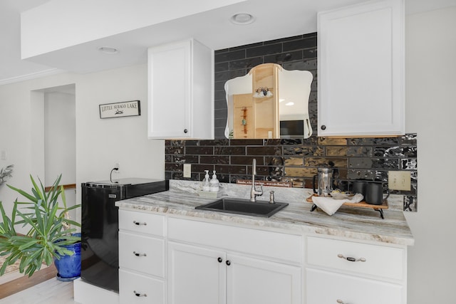 16 Gin Mill Ln, Windham, ME 04062 - kitchen with a sink, tasteful backsplash, white cabinets, light stone countertops, and recessed lighting