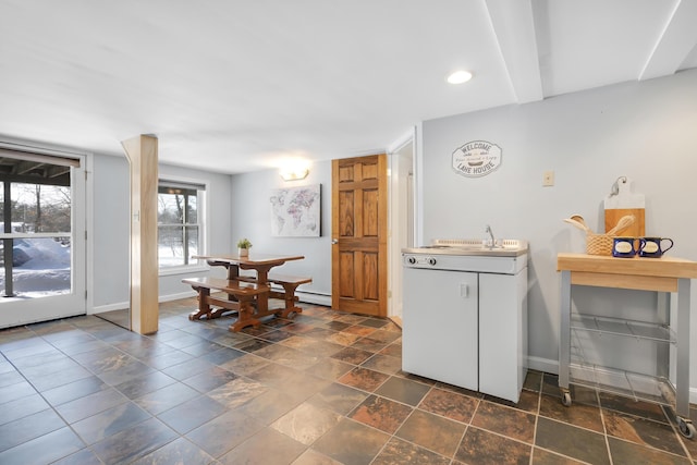 16 Gin Mill Ln, Windham, ME 04062 - kitchen with baseboards, recessed lighting, a baseboard heating unit, light countertops, and a sink
