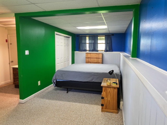 141 Cushman Rd, Winslow, ME 04901 - bedroom featuring a drop ceiling, carpet, a closet, and baseboards