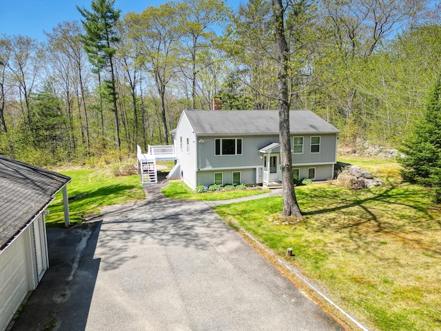 15 Northwood Ct, Wiscasset, ME 04578 - split foyer home with a chimney, a front lawn, and stairway