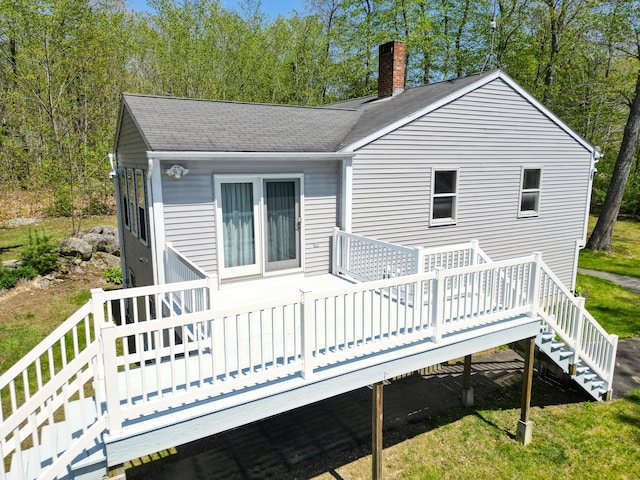 15 Northwood Ct, Wiscasset, ME 04578 - back of house with a chimney, a wooden deck, roof with shingles, and stairway