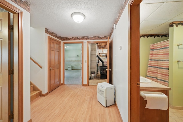 15 Northwood Ct, Wiscasset, ME 04578 - hall with baseboards, light wood-style floors, and stairway