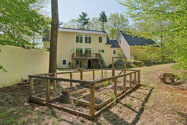 76 Asbury Ln, Acton, ME 04001 - rear view of property with stairs, a deck, and a garden