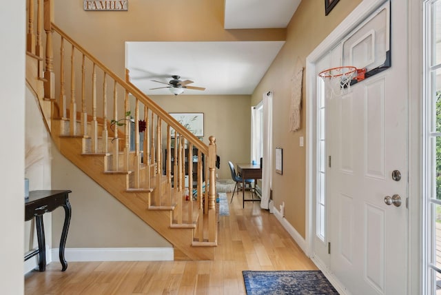 76 Asbury Ln, Acton, ME 04001 - entryway with wood finished floors, stairway, ceiling fan, and baseboards