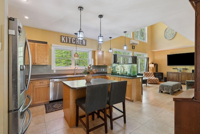 76 Asbury Ln, Acton, ME 04001 - kitchen featuring stainless steel appliances, a sink, open floor plan, dark countertops, and recessed lighting
