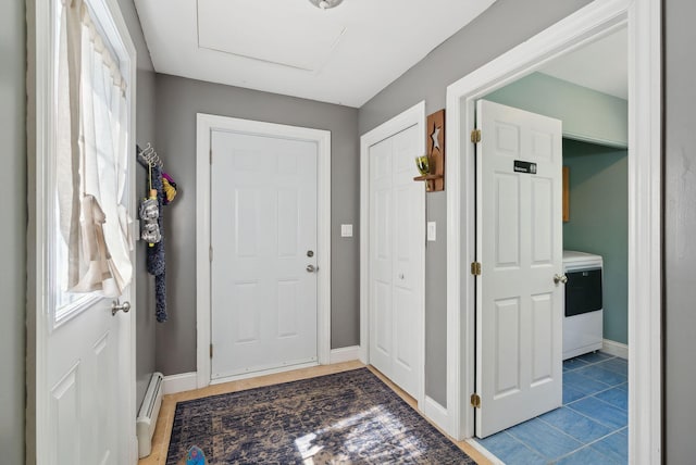 76 Asbury Ln, Acton, ME 04001 - entrance foyer with baseboard heating, washer / dryer, and baseboards