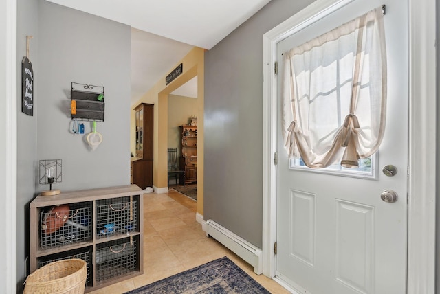 76 Asbury Ln, Acton, ME 04001 - foyer entrance with a baseboard heating unit, plenty of natural light, light tile patterned flooring, and baseboards