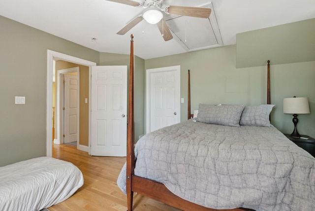 76 Asbury Ln, Acton, ME 04001 - bedroom with attic access, light wood-style floors, and a ceiling fan