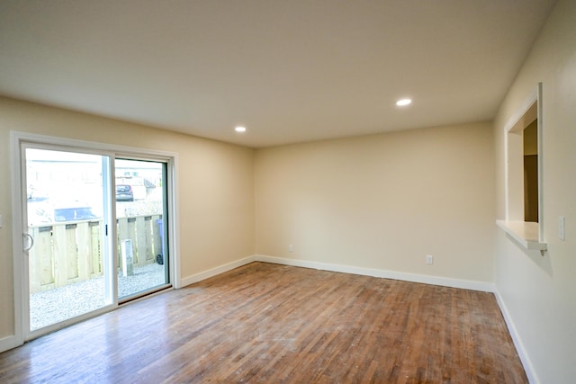 57 Mountfort St, Portland, ME 04101 - unfurnished room with wood finished floors, baseboards, and recessed lighting
