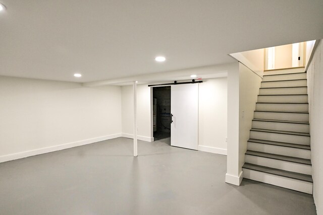 57 Mountfort St, Portland, ME 04101 - finished basement featuring recessed lighting, baseboards, a barn door, and stairway