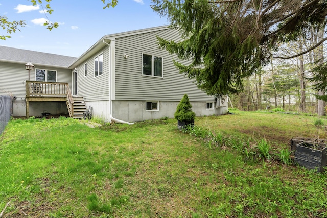 35 Burnt Mill Rd Unit B, Wells, ME 04090 - view of home's exterior with a wooden deck and a lawn