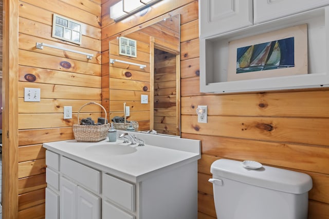 35 Burnt Mill Rd Unit B, Wells, ME 04090 - half bathroom with wood walls, toilet, and vanity