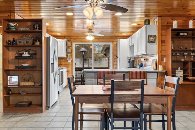 35 Burnt Mill Rd Unit B, Wells, ME 04090 - dining room with a ceiling fan, wood ceiling, light tile patterned flooring, recessed lighting, and wooden walls