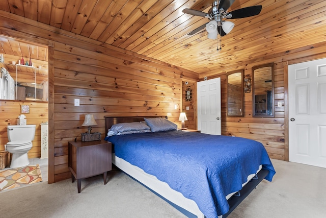 35 Burnt Mill Rd Unit B, Wells, ME 04090 - bedroom featuring carpet, wood walls, wood ceiling, and connected bathroom