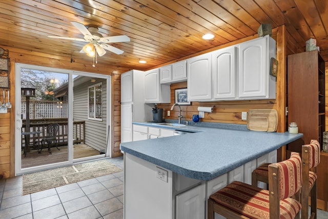 35 Burnt Mill Rd Unit B, Wells, ME 04090 - kitchen featuring wood walls, light tile patterned floors, wooden ceiling, a ceiling fan, and a sink