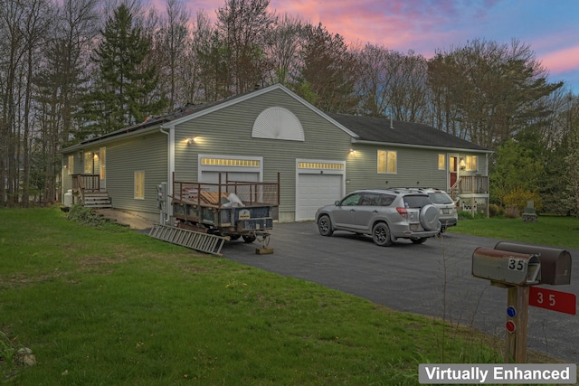 35 Burnt Mill Rd Unit B, Wells, ME 04090 - view of front facade featuring asphalt driveway, a front lawn, an attached garage, and view of wooded area