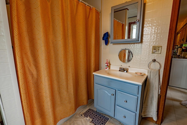 40 Merrow Rd, Auburn, ME 04210 - full bathroom with vanity, tile patterned flooring, and washer / dryer