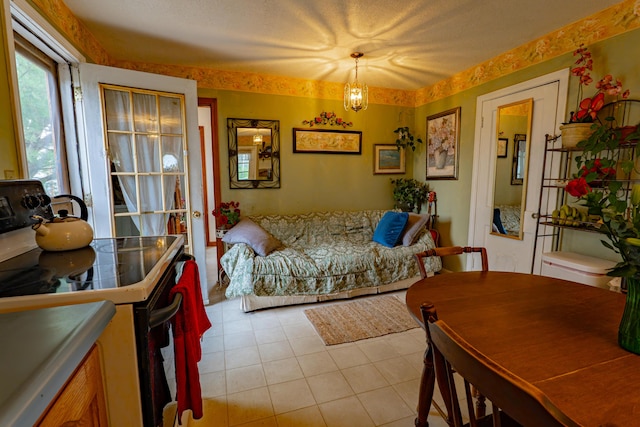 40 Merrow Rd, Auburn, ME 04210 - living room with light tile patterned floors and a chandelier