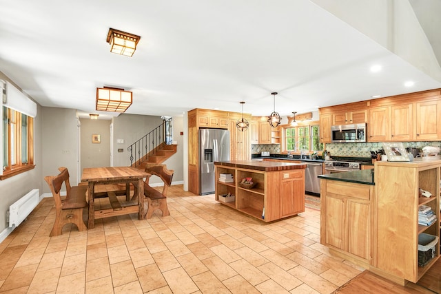 43 Creek Xing, Eliot, ME 03903 - kitchen with open shelves, stainless steel appliances, radiator, dark countertops, and recessed lighting
