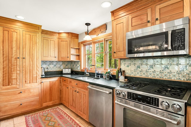 43 Creek Xing, Eliot, ME 03903 - kitchen featuring appliances with stainless steel finishes, a sink, dark countertops, tasteful backsplash, and recessed lighting