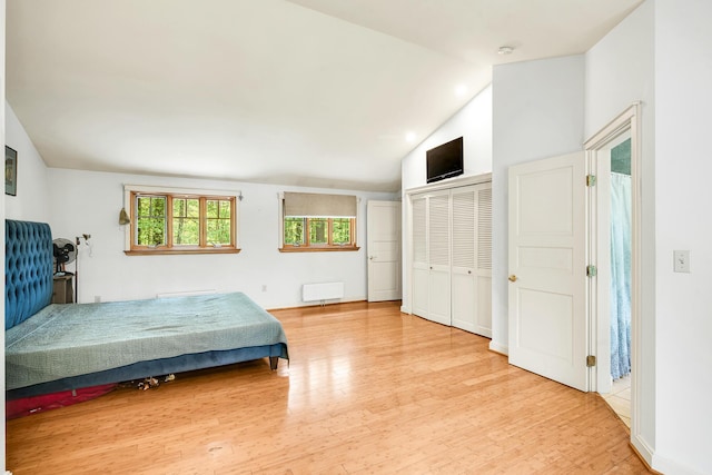 43 Creek Xing, Eliot, ME 03903 - bedroom with wood finished floors, lofted ceiling, and radiator heating unit