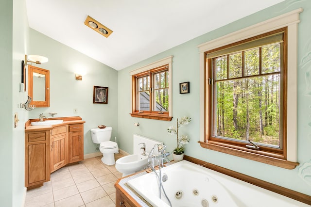 43 Creek Xing, Eliot, ME 03903 - bathroom with lofted ceiling, toilet, a whirlpool tub, vanity, and tile patterned flooring