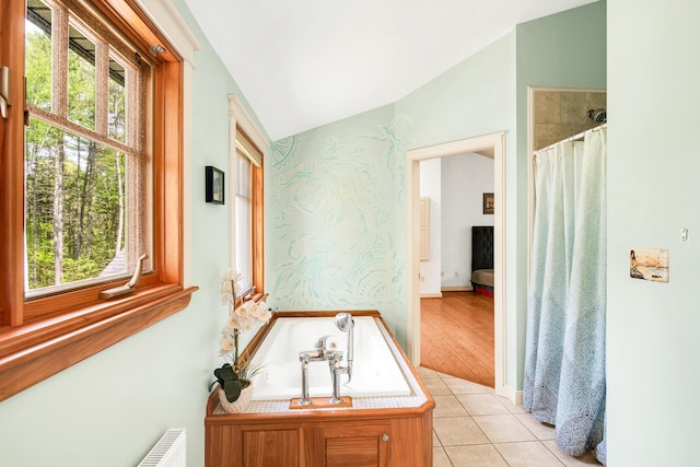 43 Creek Xing, Eliot, ME 03903 - bathroom featuring vaulted ceiling, healthy amount of natural light, tile patterned flooring, a bath, and wallpapered walls